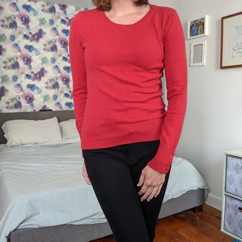 Red sweater with sleeve button detail